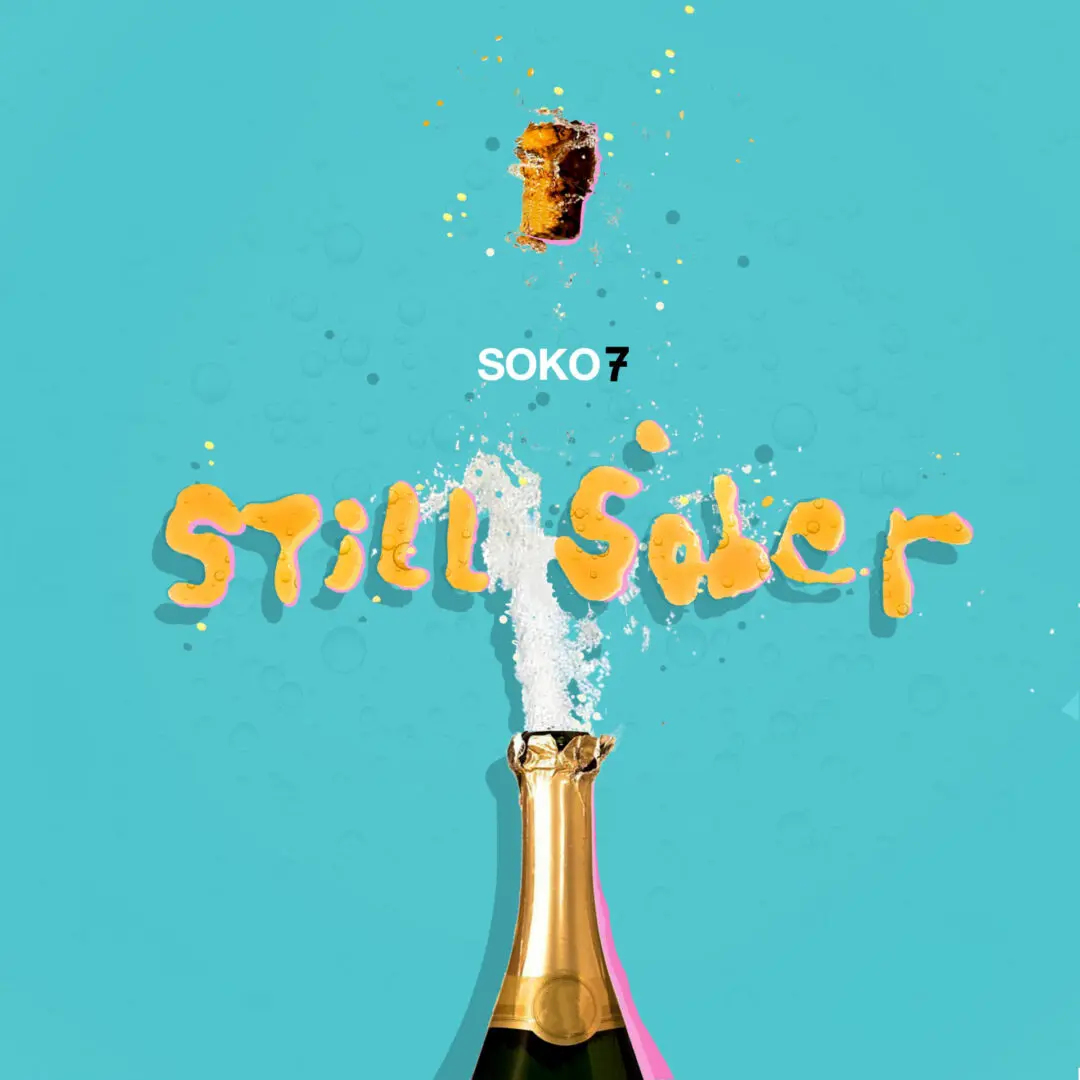 A bottle of champagne with the word " sober " written on it.